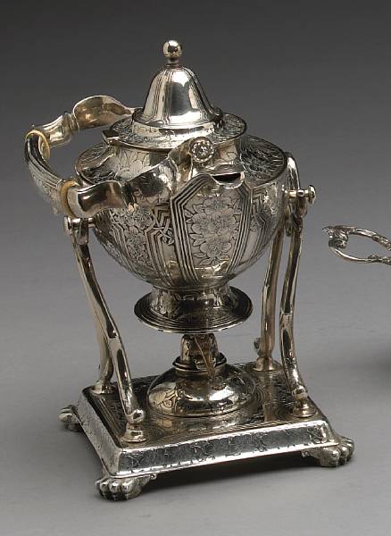 Appraisal: A sterling pints kettle on lamp stand with etched floral