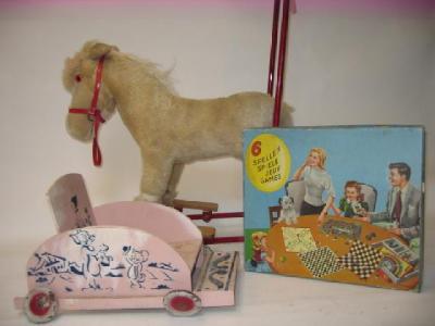 Appraisal: A Deans push-along horse on wheels tubular steel frame fabric