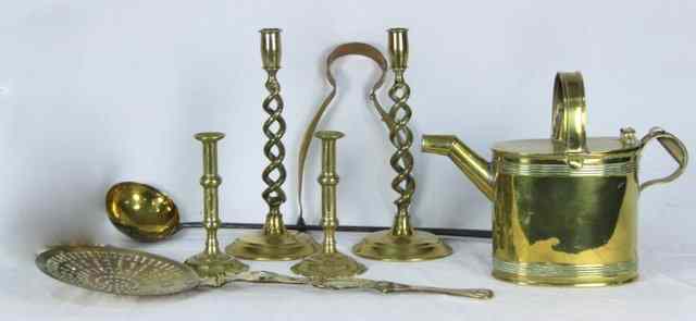 Appraisal: A quantity of brass including a pair of candlesticks on