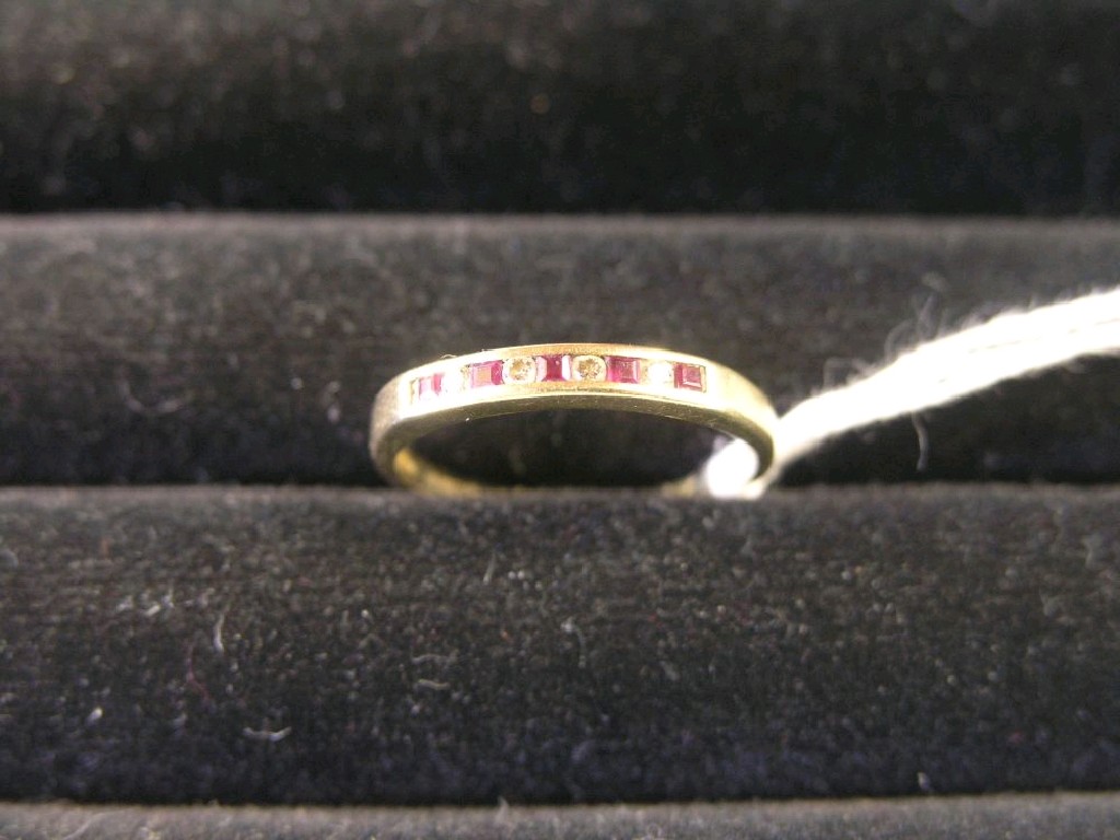 Appraisal: A ct gold ring set with five red and four