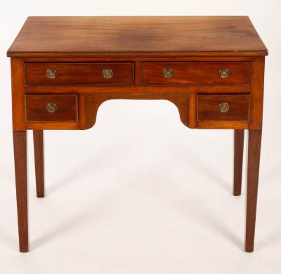 Appraisal: A th Century mahogany kneehole table fitted four drawers on