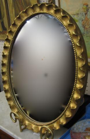 Appraisal: Oval carved wood frame wall mirror with gold finish x