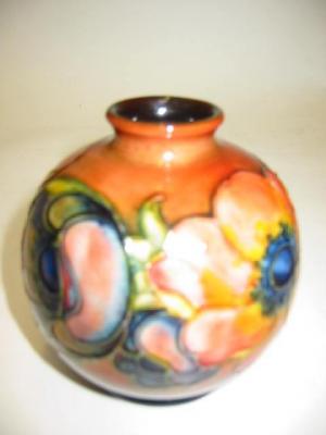 Appraisal: A MOORCROFT POTTERY ANEMONE PATTERN VASE of globular form tube