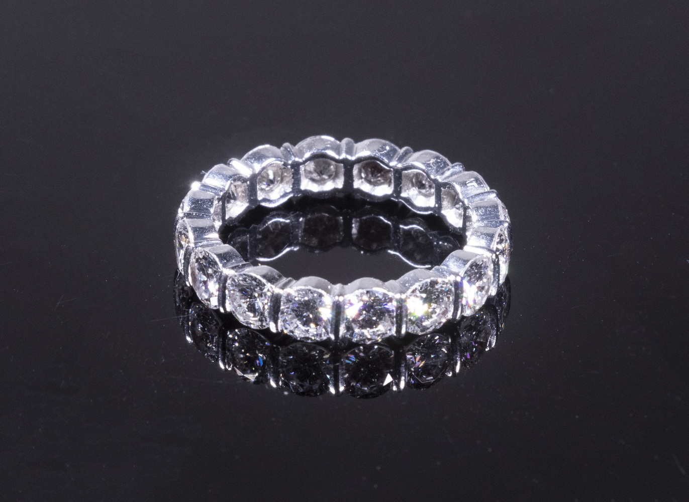 Appraisal: PLATINUM AND DIAMOND ETERNITY BAND Set with round brilliant cut