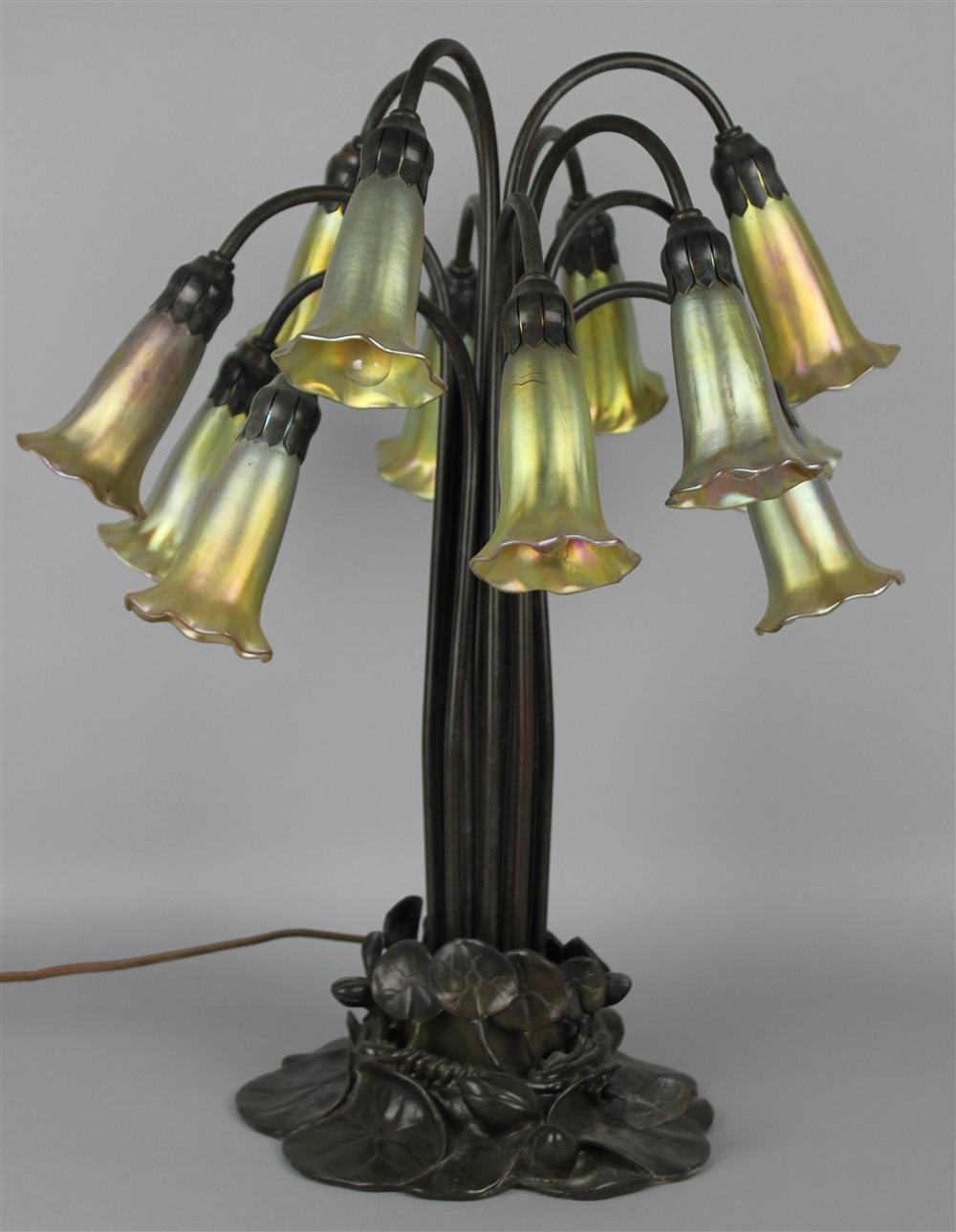 Appraisal: ART NOUVEAU TIFFANY STYLE PATINATED METAL AND IRIDESCENT GLASS TWELVE-LIGHT