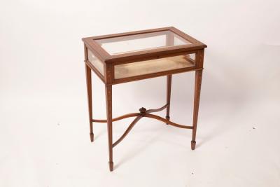 Appraisal: An Edwardian satinwood painted and decorated display table with bevelled