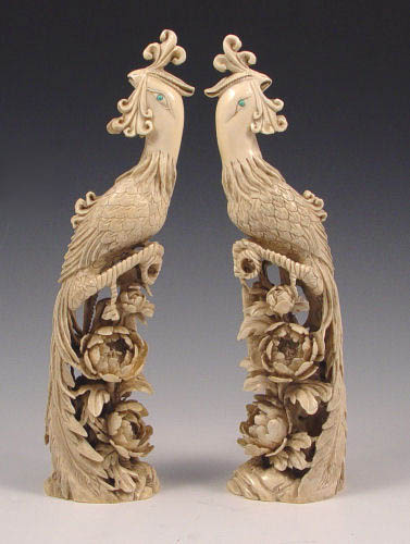 Appraisal: PAIR ASIAN CARVED IVORY PHOENIX BIRDS Each carved from a