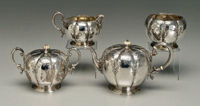 Appraisal: Four-piece sterling tea service melon forms with scroll handles scroll