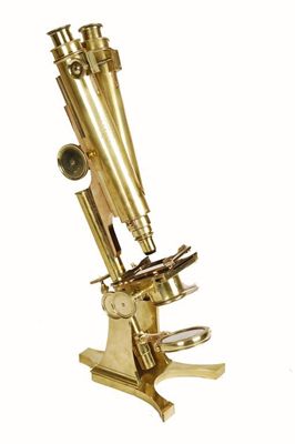 Appraisal: A lacquered brass binocular microscope with rack and pinion and