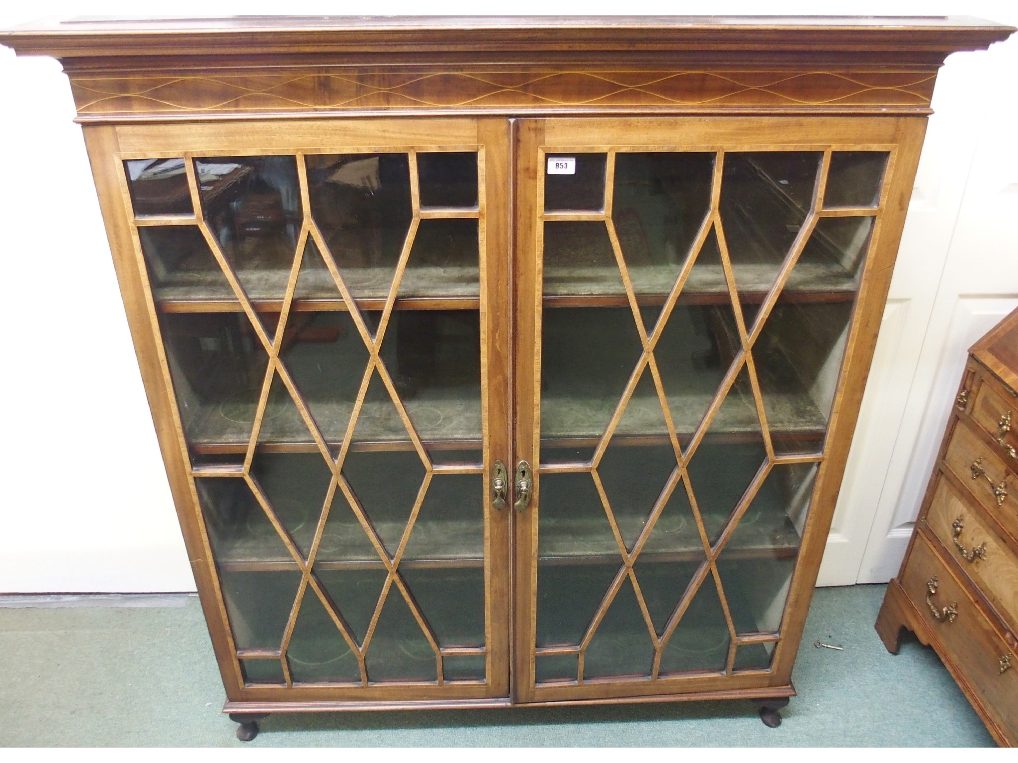 Appraisal: An Edwardian mahogany inlaid glazed display cabinet top x x