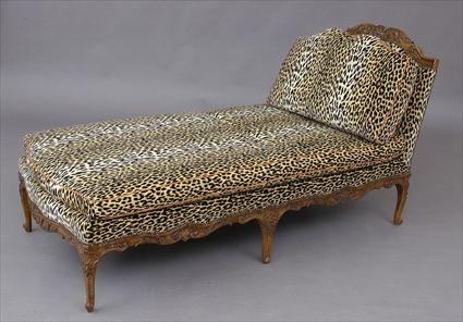 Appraisal: REGENCE CARVED WALNUT CHAISE LONGUE The headrest with shell and