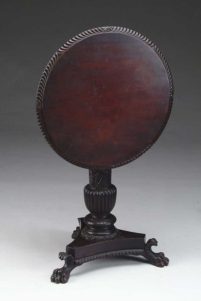 Appraisal: CLASSICAL MAHOGANY CARVED CENTER TABLE Circular tilting top with gadroon