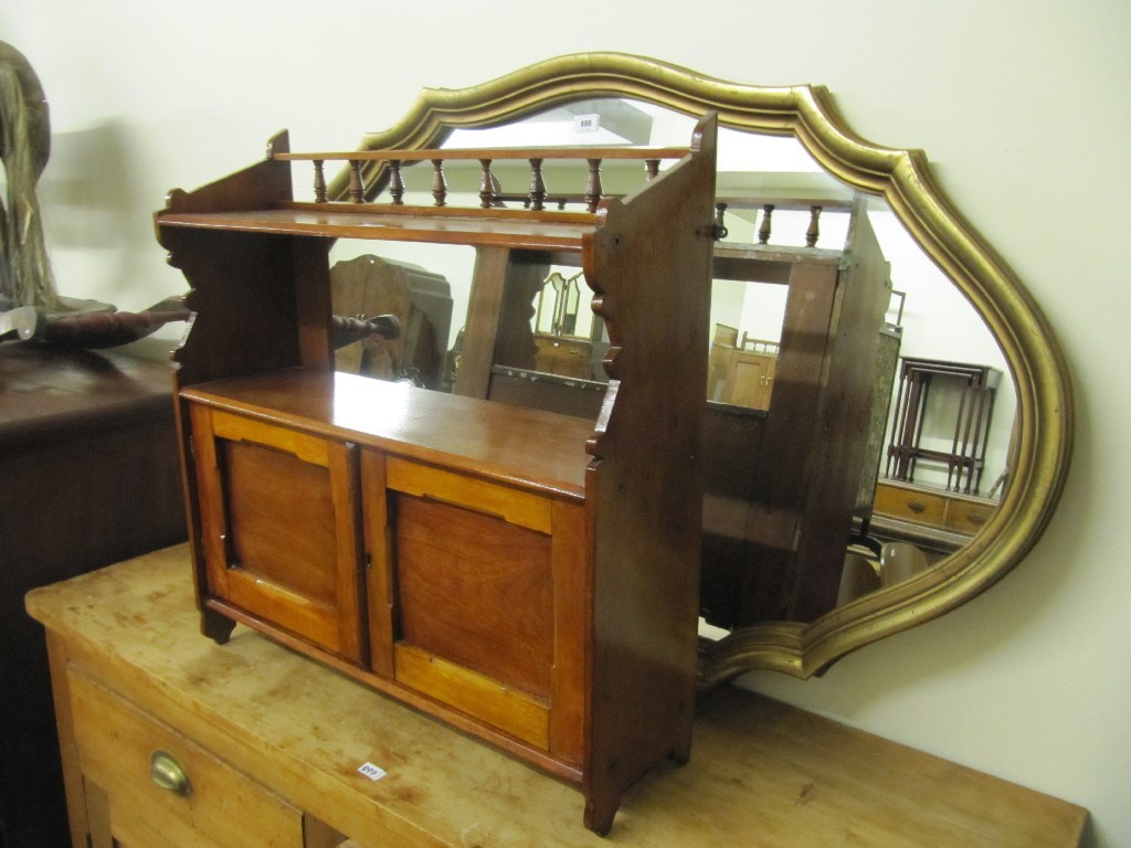 Appraisal: Gilt framed wall mirror and a mahogany wall mounting cupboard