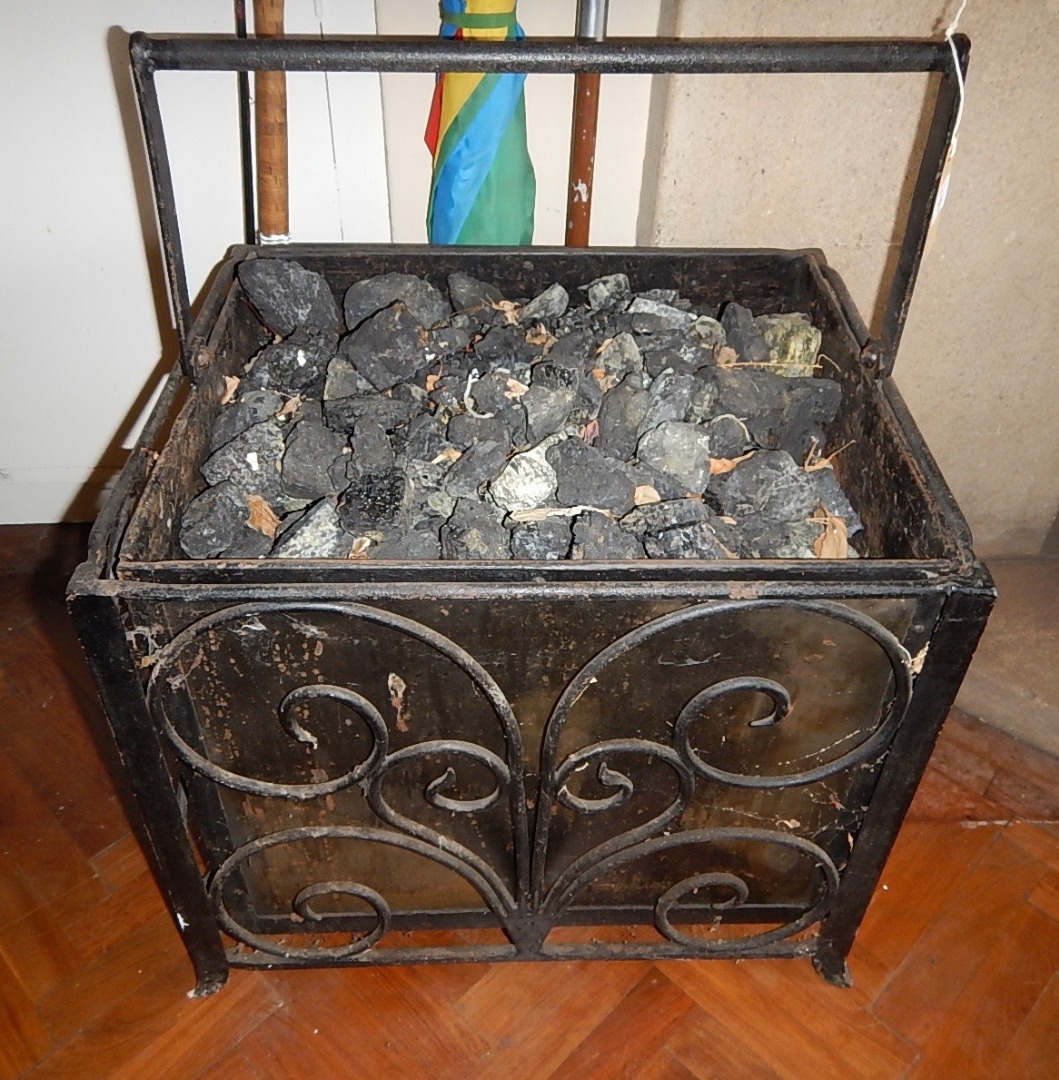 Appraisal: A wrought iron and steel coal box with swing handle