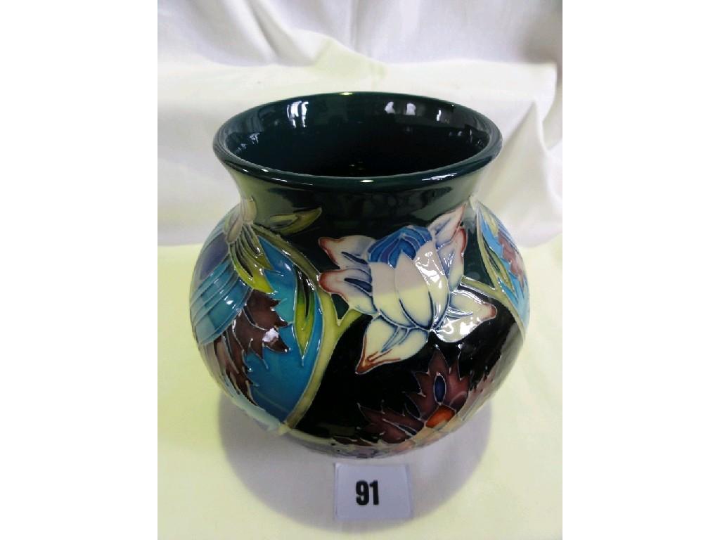 Appraisal: A Moorcroft pottery vase with painted moulded and stylised organic