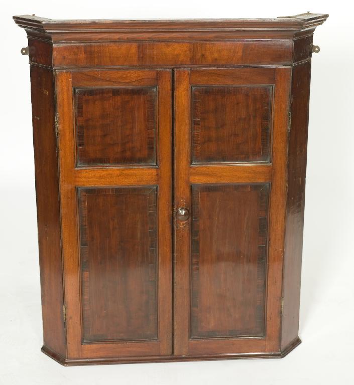 Appraisal: GEORGE III MAHOGANY HANGING CORNER CUPBOARD with moulded cornice above