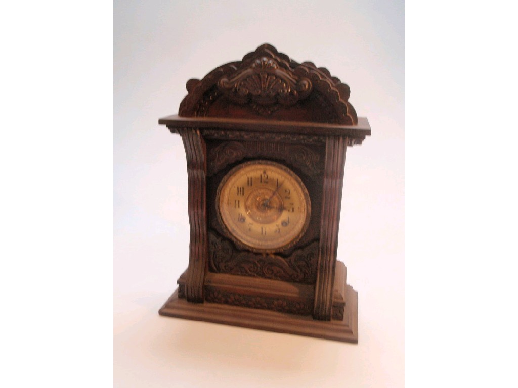 Appraisal: An early thC American gingerbread mantel clock by Ansonia Clock