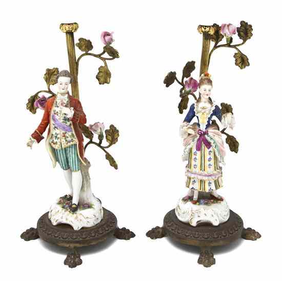 Appraisal: A Pair of German Porcelain Figures modeled as a man