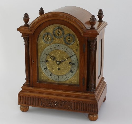 Appraisal: An Edwardian walnut eight-day mantel clock the arch top case