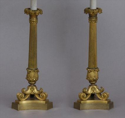 Appraisal: PAIR OF EMPIRE-STYLE GILT-METAL COLUMN-FORM LAMPS Each reeded stem with