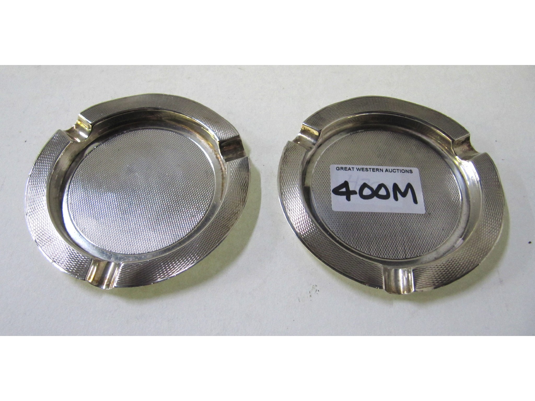 Appraisal: A pair of silver ashtrays Birmingham