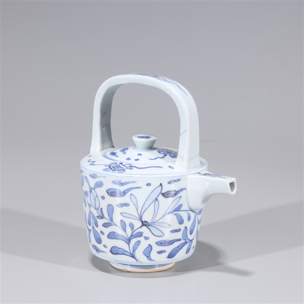 Appraisal: Korean blue and white glazed porcelain covered teapot with floral