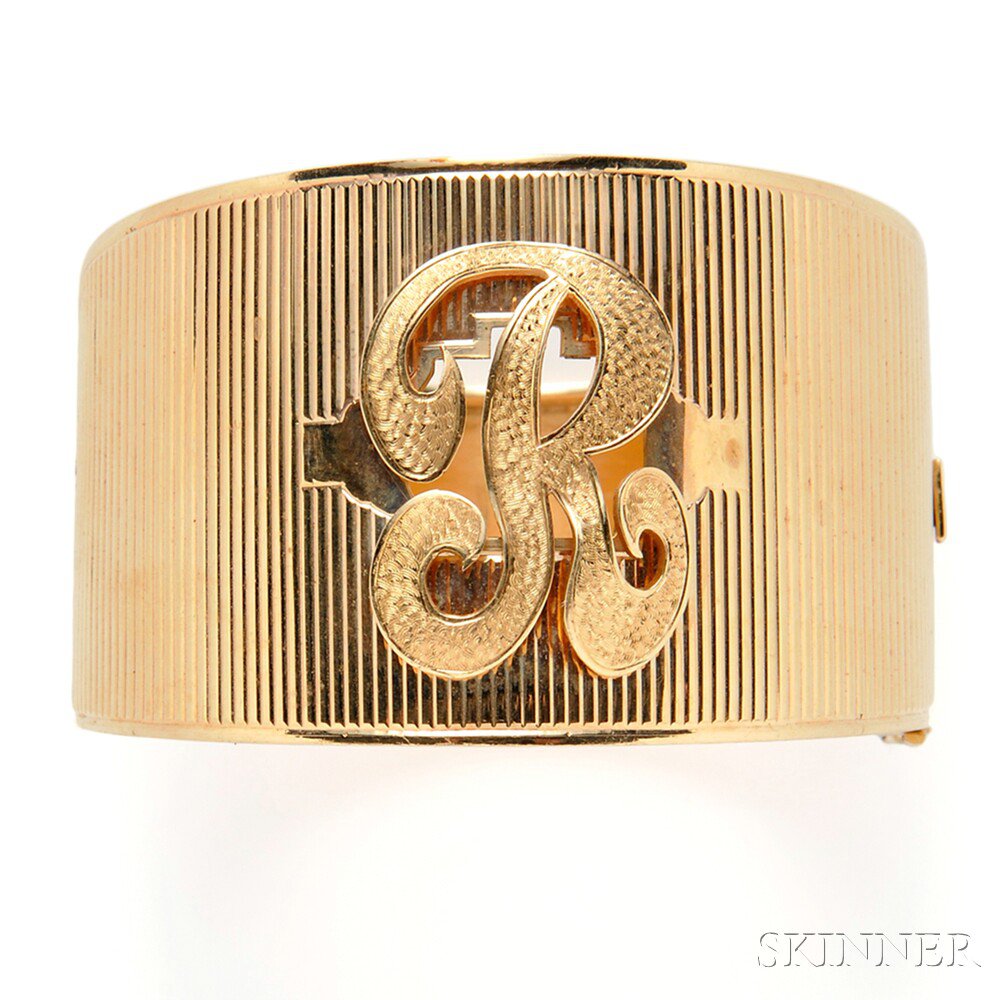 Appraisal: kt Gold Bracelet the hinged tapering ribbed cuff with monogram