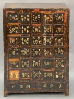 Appraisal: Chinese spice cabinet with thirty-two drawers each with ring pulls