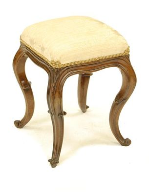 Appraisal: A Victorian rosewood stool the later upholstered seat on moulded