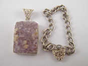 Appraisal: A white metal tests silver bracelet and an amethyst crystal