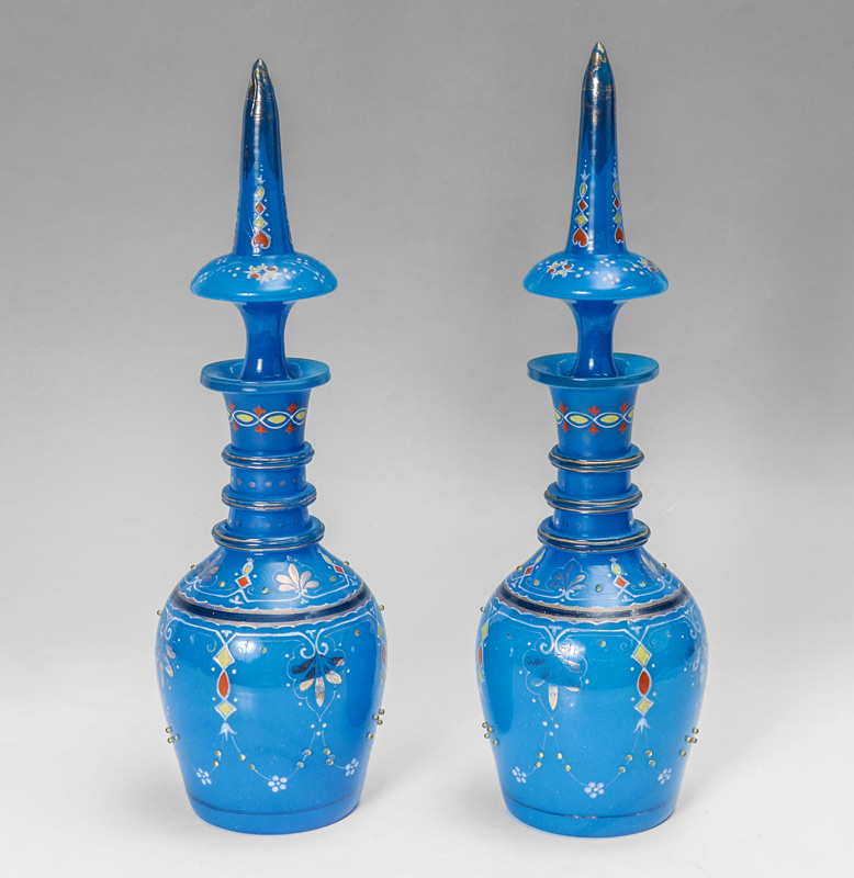 Appraisal: PAIR BOHEMIAN OTTOMAN STYLE GLASS DECANTERS Blue opaline glass with