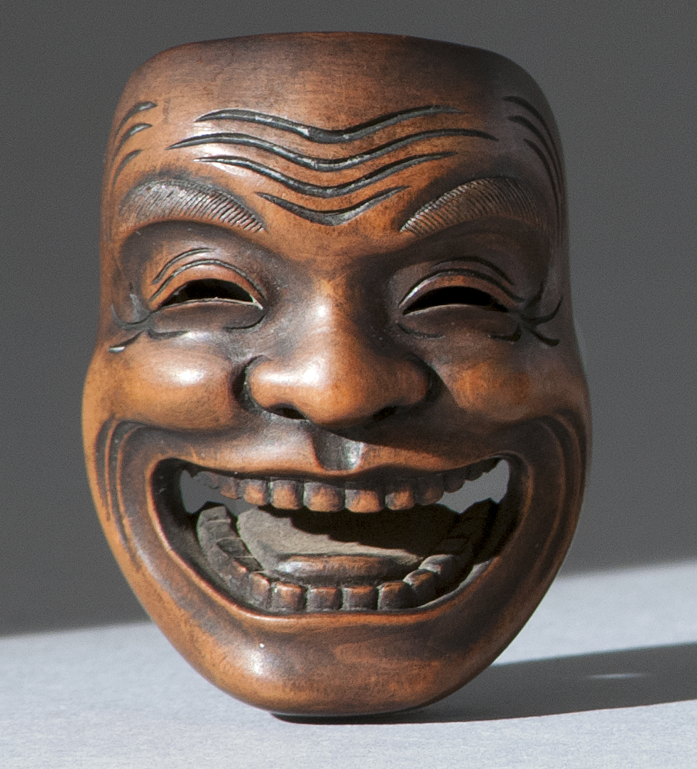 Appraisal: WOOD MASK NETSUKE th CenturyBy Gyokusai Depicting a laughing man