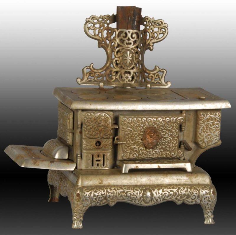 Appraisal: Cast Iron Queen Children's Toy Stove Description Appears to be