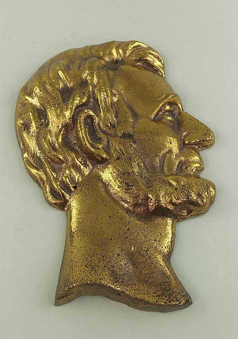 Appraisal: BRASS PLAQUE OF A LINCOLN BUST IN PROFILEEarly to mid