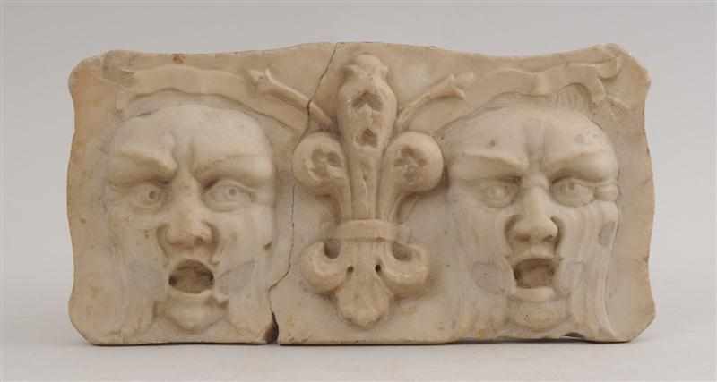 Appraisal: FRENCH CARVED MARBLE ARCHITECTURAL RELIEF FRAGMENT With two grotesque masks