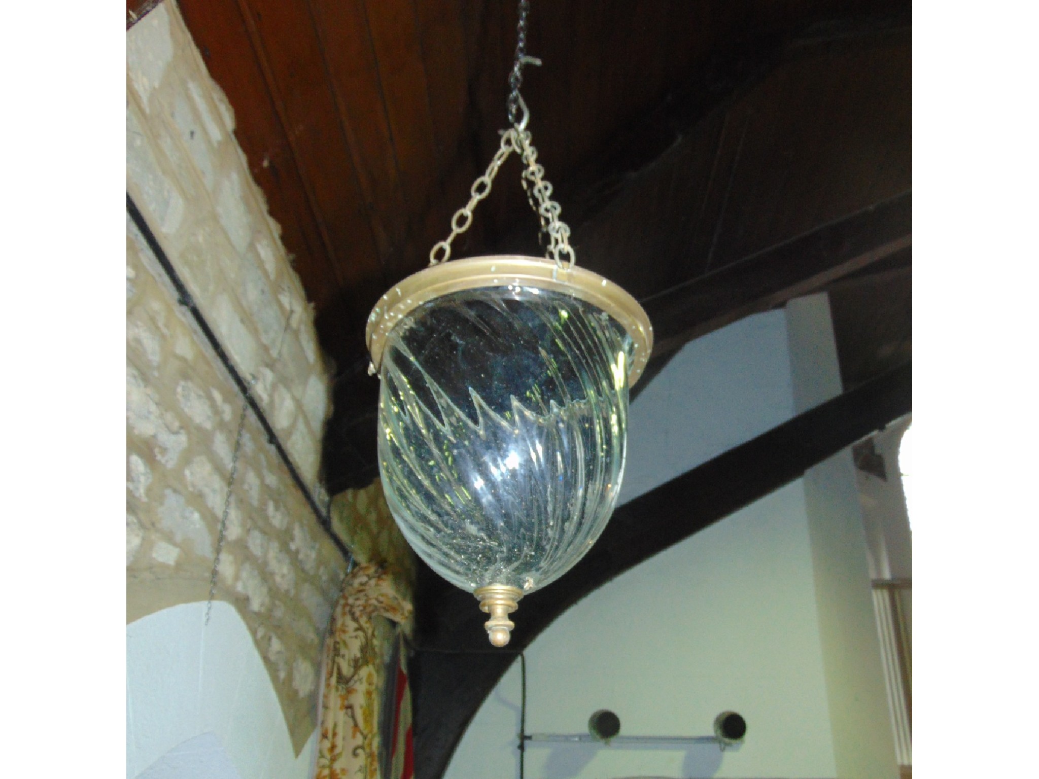 Appraisal: A writhen moulded glass hanging pendant light with brass fittings