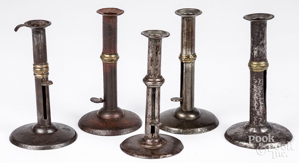 Appraisal: Five hogscraper candlesticks th c Five hogscraper candlesticks th c