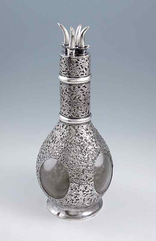 Appraisal: WAI KEE REPOUSSE STERLING OVERLAY CRUET Floral design repousse sterling