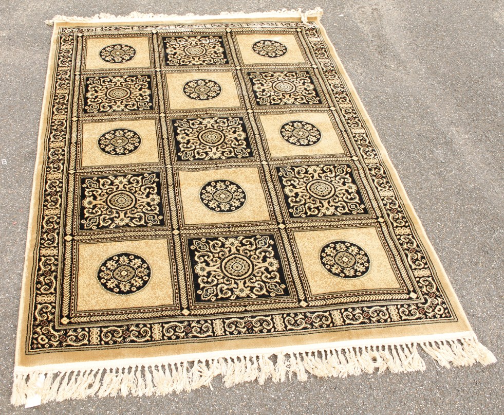 Appraisal: A thC rug in geometric floral pattern predominantly in cream