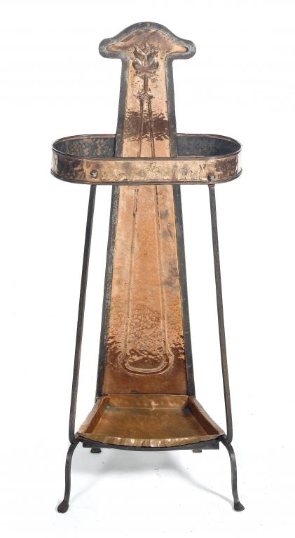 Appraisal: A LIBERTY CO IRON FRAMED COPPER UMBRELLA STAND embossed with