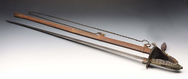 Appraisal: A VICTORIAN OFFICERS DRESS SWORD with engraved steel blade and