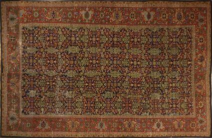 Appraisal: PERSIAN CARPET The cobalt ground with floral trellis overlay within