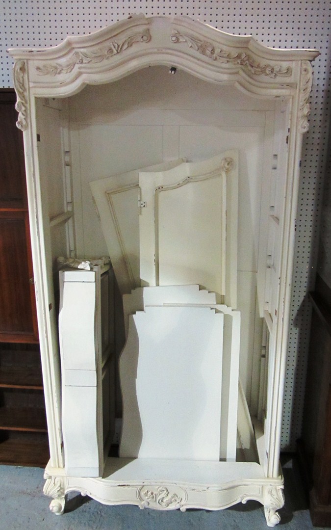 Appraisal: A th century white painted two door wardrobe with carved