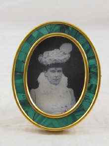 Appraisal: A Russian brass photo frame with inset malachite border x