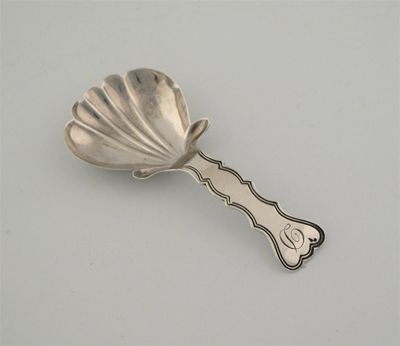 Appraisal: A George III IV spoon with a part fluted bowl