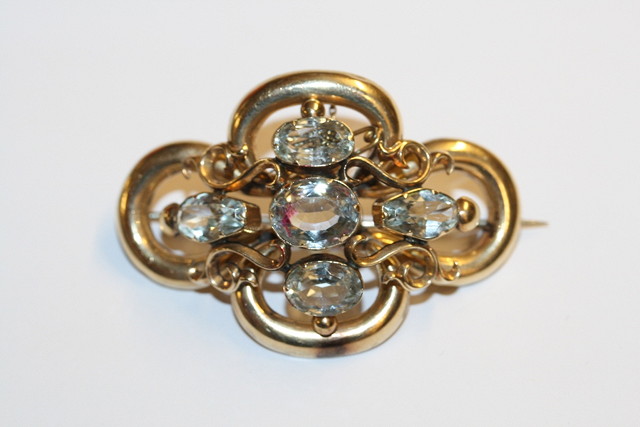 Appraisal: A LATE VICTORIAN BROOCH set with five oval facetted aquamarines