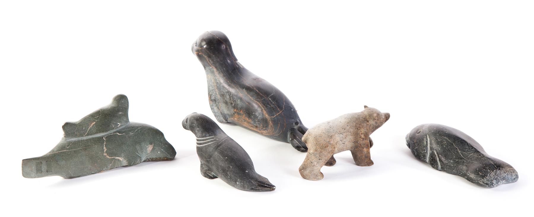 Appraisal: FIVE INUIT CARVED ANIMALS Twentieth century hardstone Seals fish and