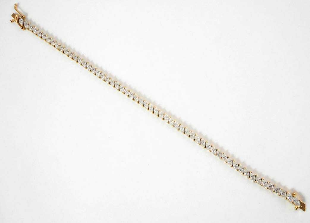 Appraisal: DIAMONIQUE FOURTEEN KARAT GOLD TENNIS BRACELET measuring inches in length