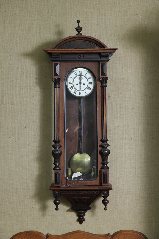 Appraisal: WALL CLOCK Eight day time strike with brass works and