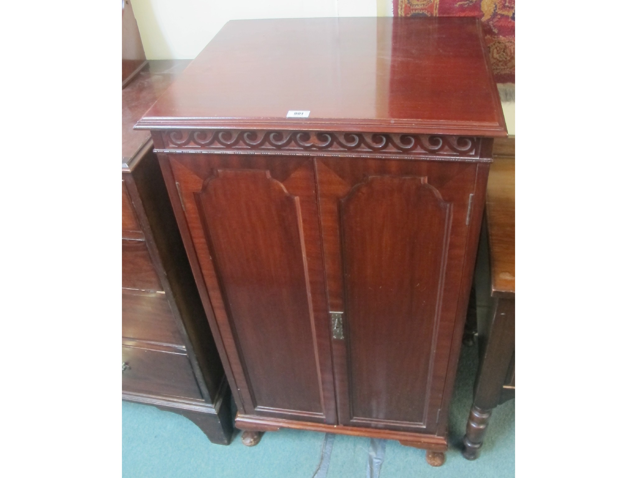 Appraisal: A mahogany two door music cabinet